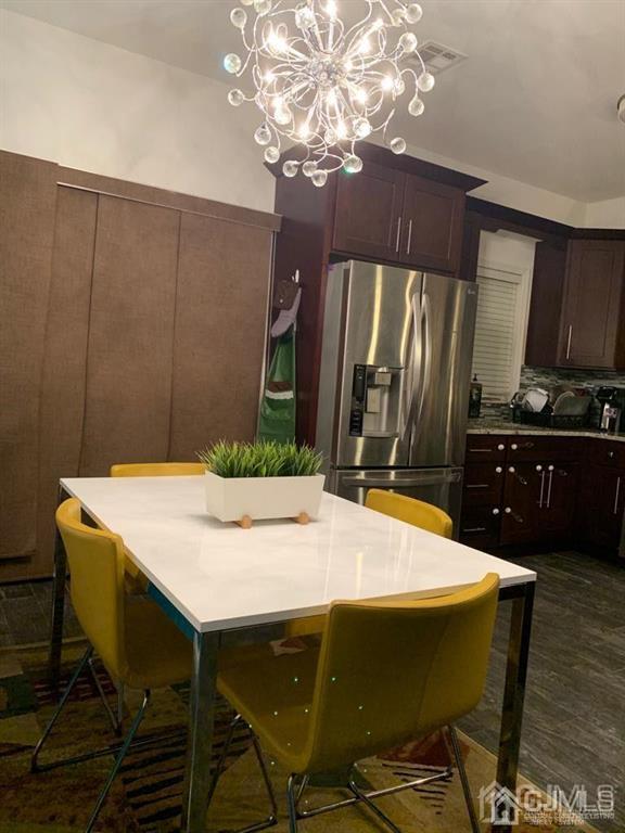 58 Christopher Street Carteret, NJ 07008 - Photo 4 of 20 a dining table chair in a kitchen