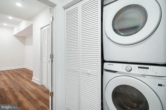 a close view of a utility room with dryer and washer