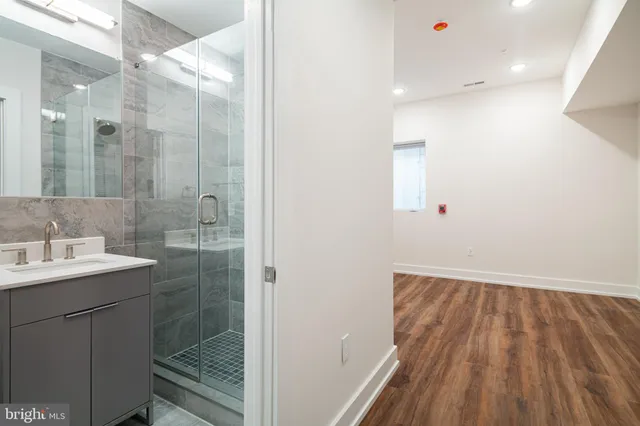 a bathroom with a sink and mirror