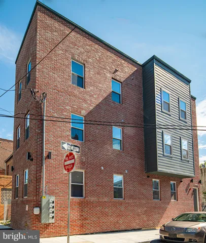 a front view of a house with parking