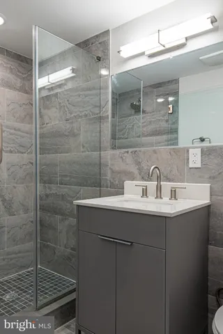 a bathroom with a sink and mirror