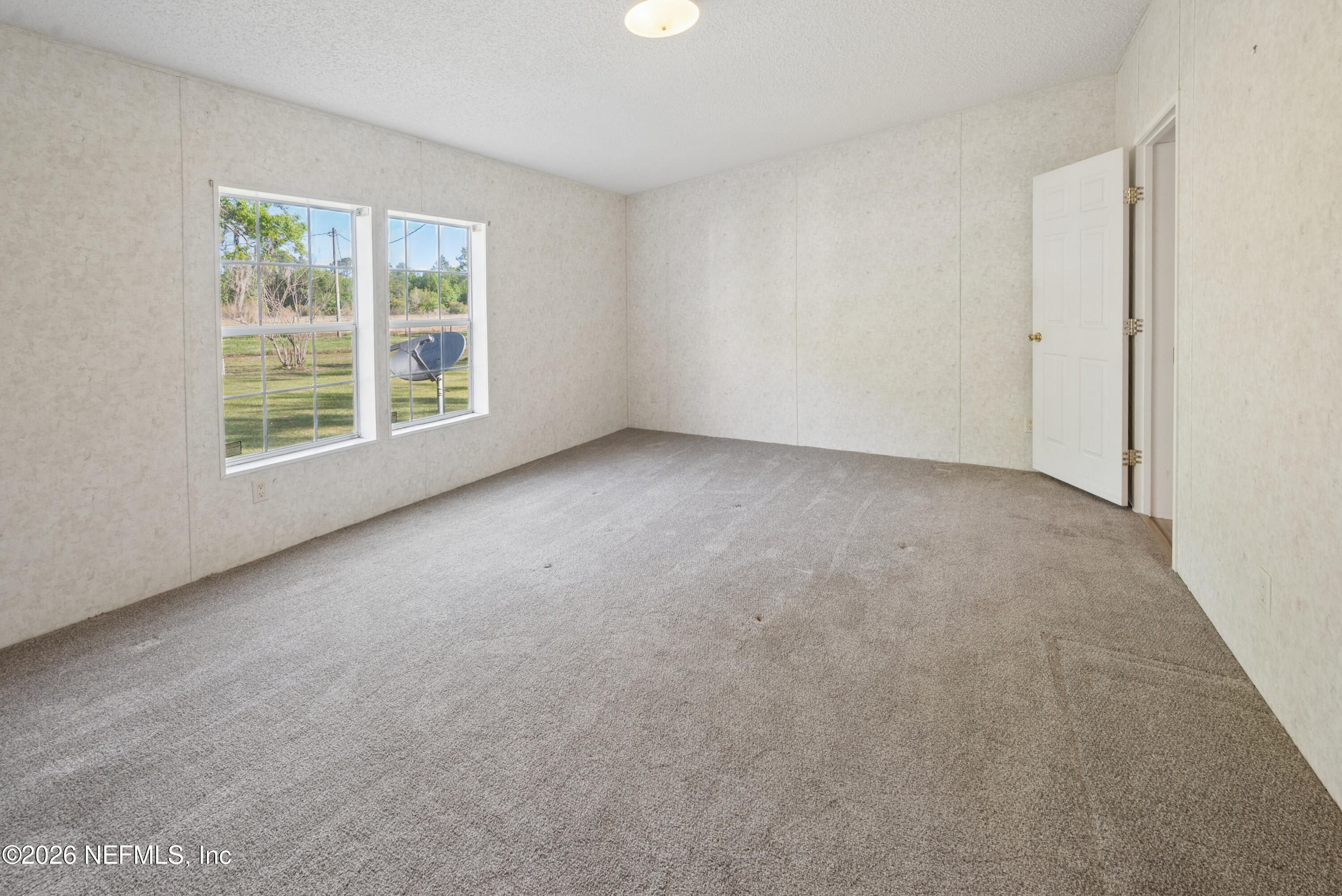3112 Southeast 120th Street Starke, FL 32091 - Photo 12 of 30 an empty room with a window