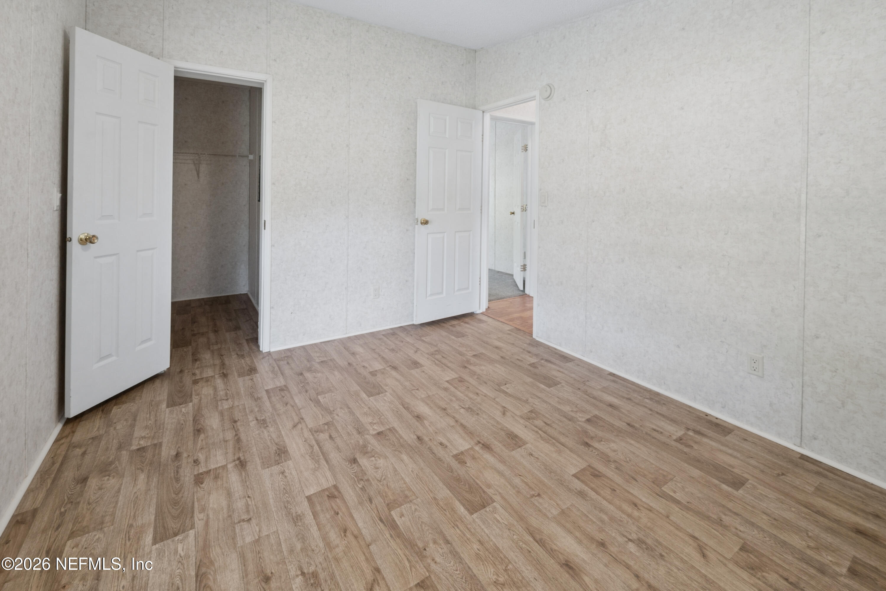 3112 Southeast 120th Street Starke, FL 32091 - Photo 16 of 30 a view of an empty room with wooden floor