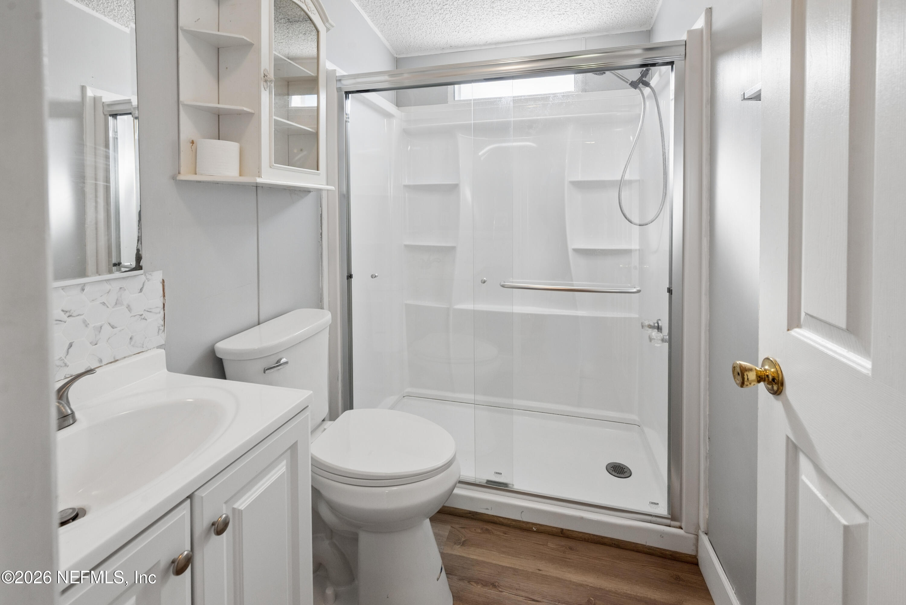 3112 Southeast 120th Street Starke, FL 32091 - Photo 17 of 30 a bathroom with a shower a toilet and a sink