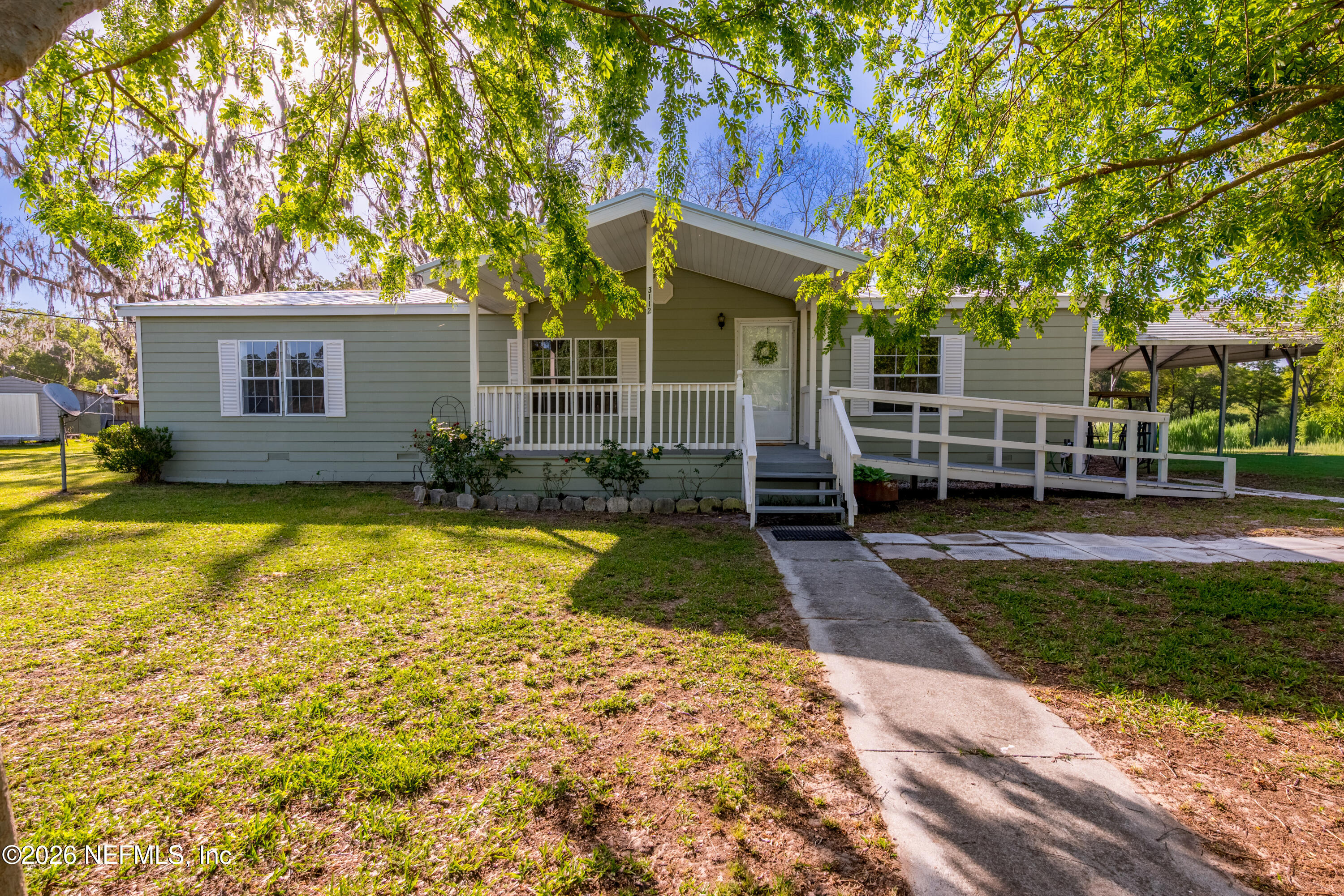 3112 Southeast 120th Street Starke, FL 32091 - Photo 22 of 30 a view of a house with a backyard