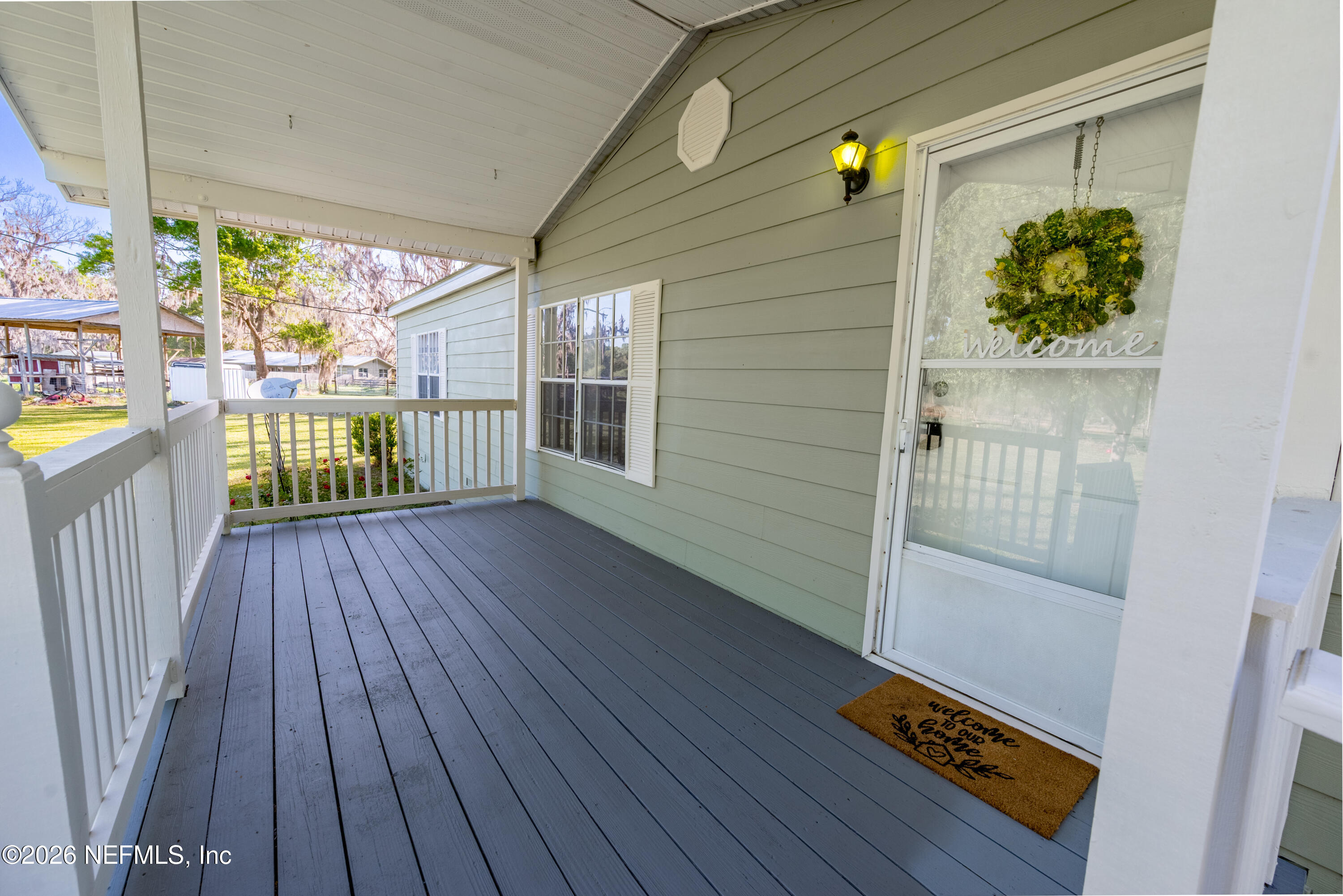 3112 Southeast 120th Street Starke, FL 32091 - Photo 24 of 30 a balcony with wooden floor