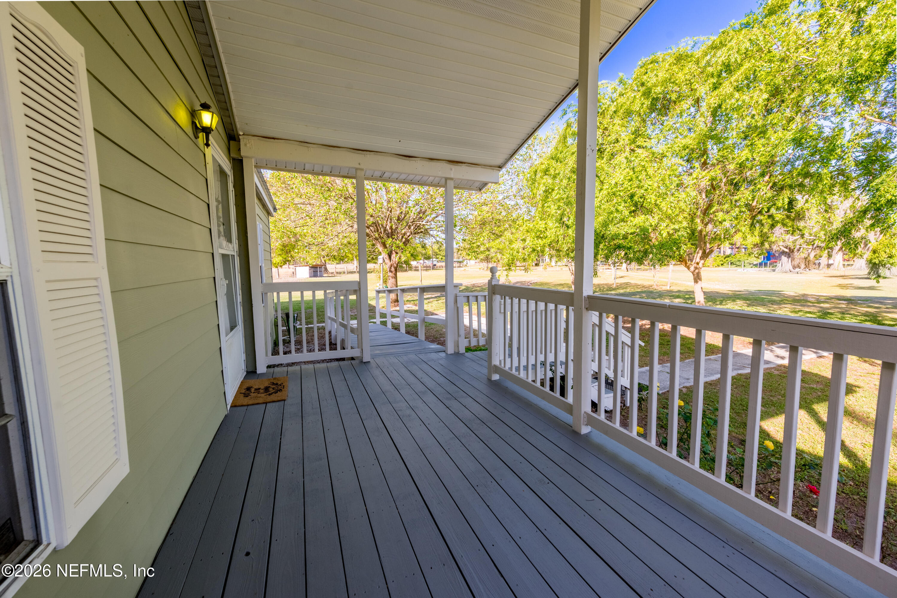 3112 Southeast 120th Street Starke, FL 32091 - Photo 25 of 30 a view of a balcony with wooden floor