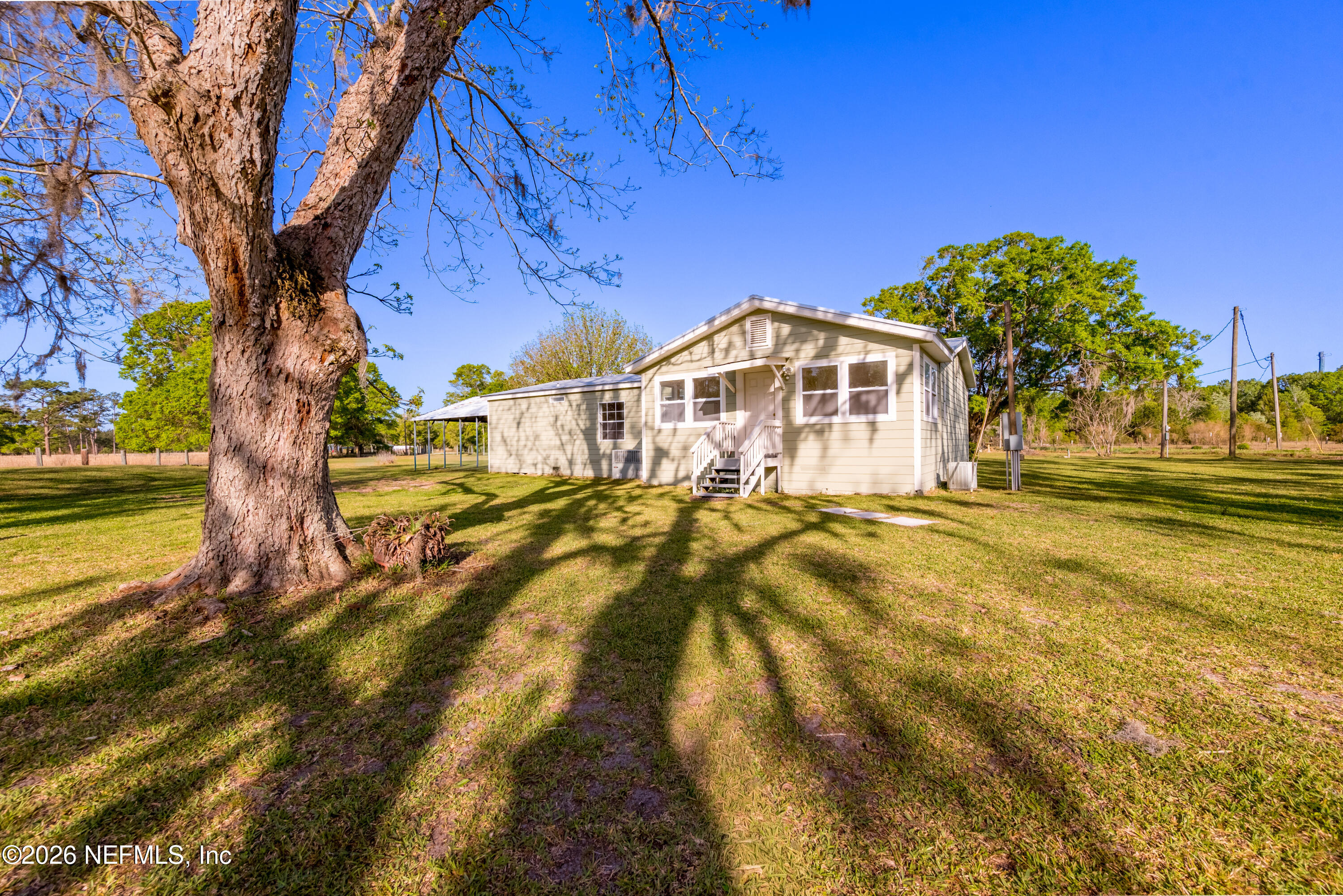 3112 Southeast 120th Street Starke, FL 32091 - Photo 27 of 30 a front view of a house with a yard