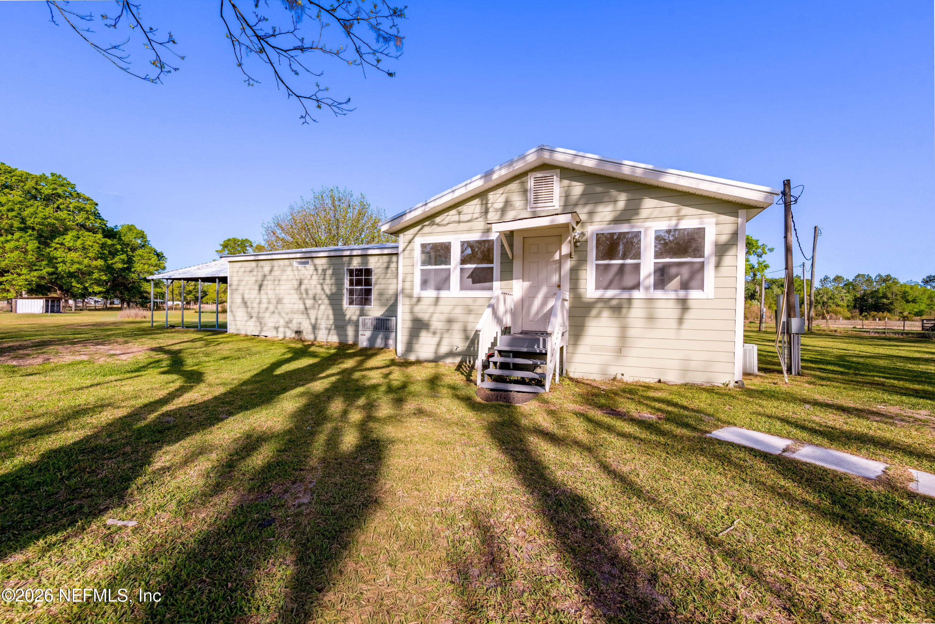 3112 Southeast 120th Street Starke, FL 32091 - Photo 28 of 30 a view of a house with pool and sitting area