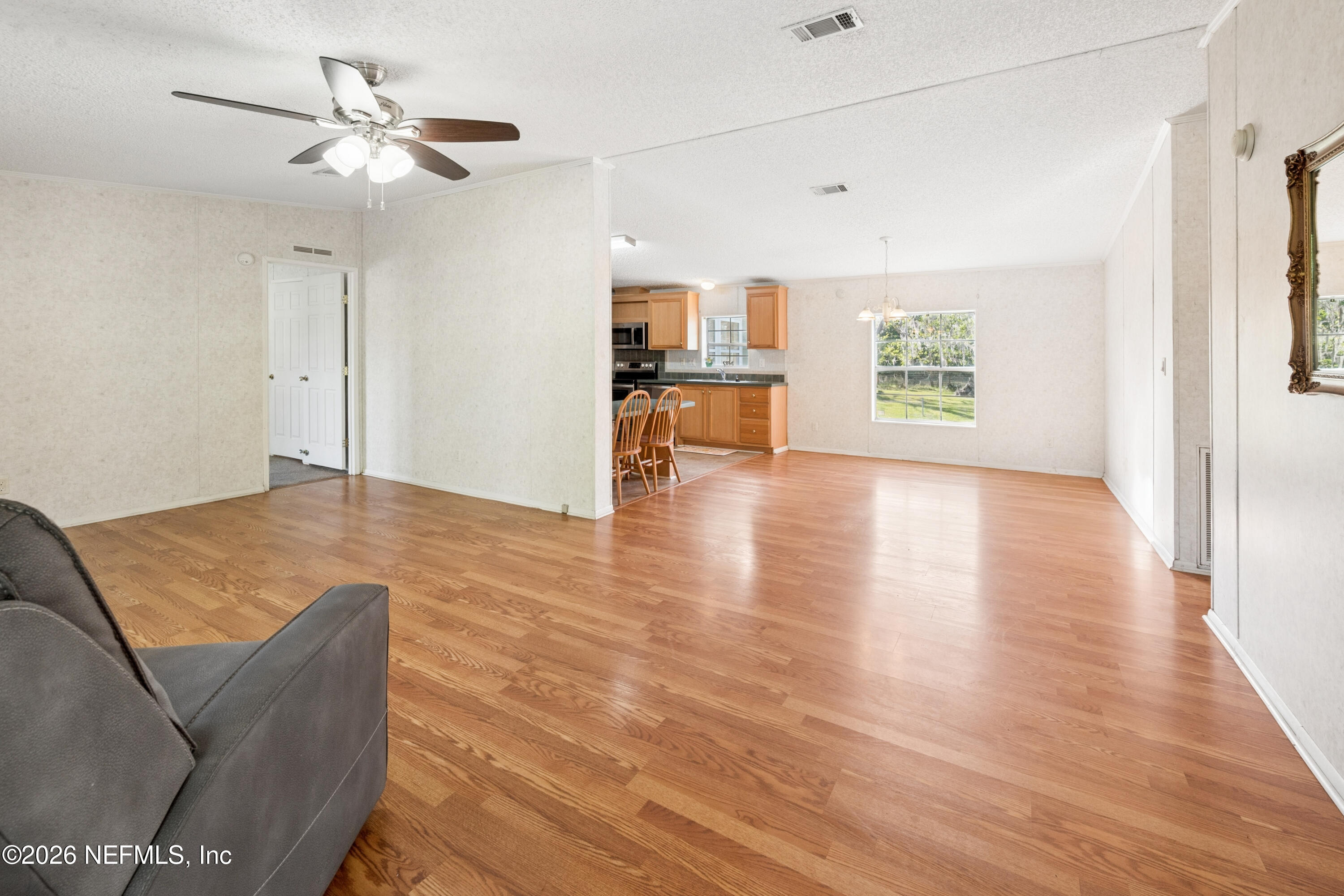 3112 Southeast 120th Street Starke, FL 32091 - Photo 5 of 30 a living room with furniture and a open kitchen view