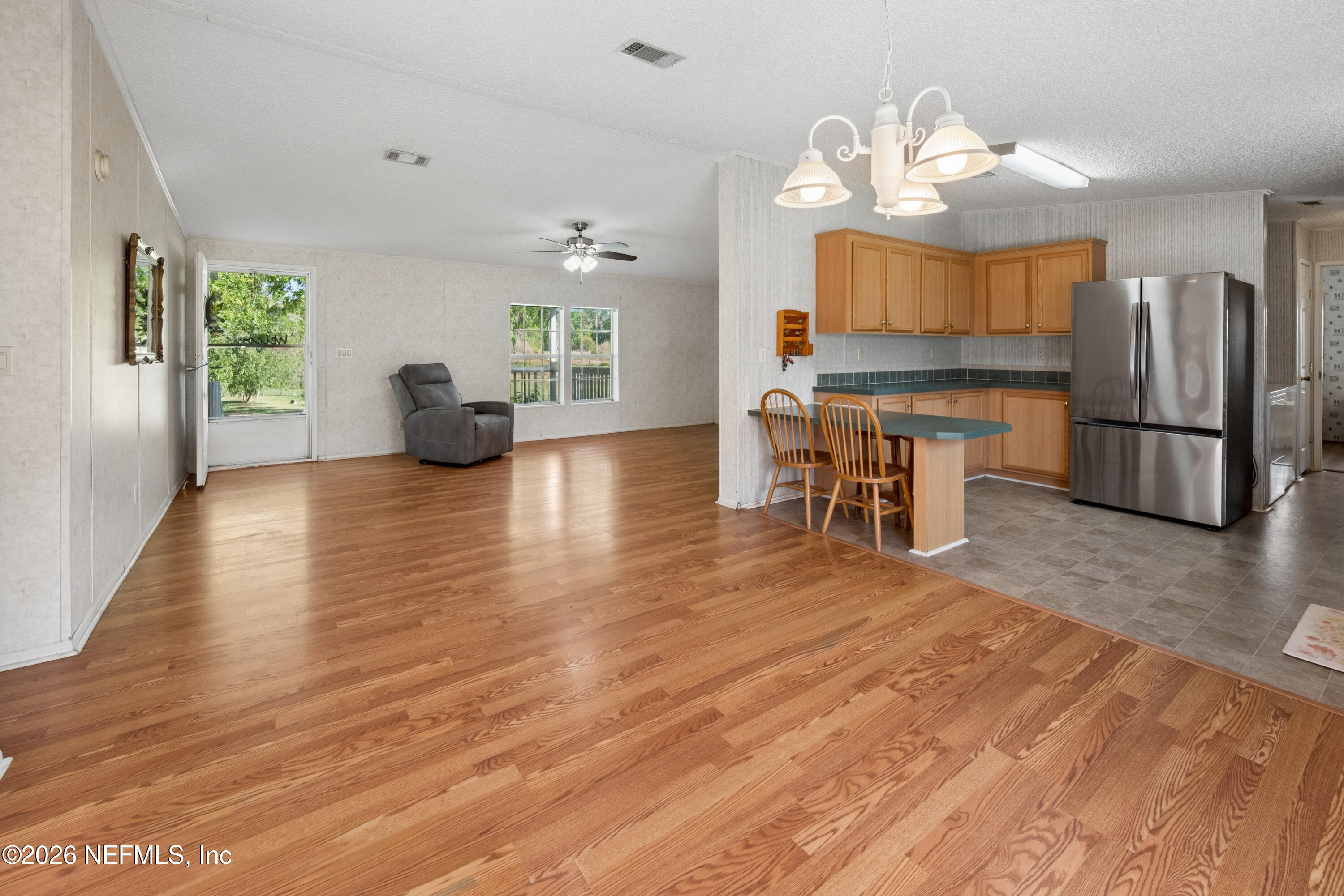 3112 Southeast 120th Street Starke, FL 32091 - Photo 7 of 30 a view of a dining room with furniture window and wooden floor