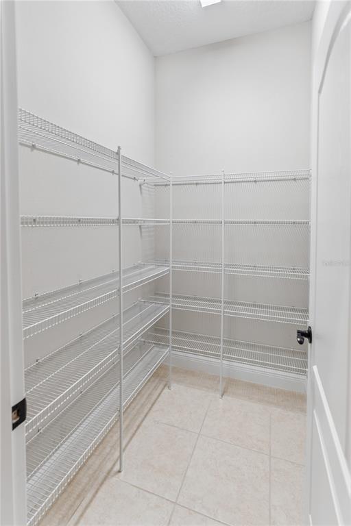 13017 Steinhatchee Loop Venice, FL 34293 - Photo 16 of 98 a view of a room with racks on the wall