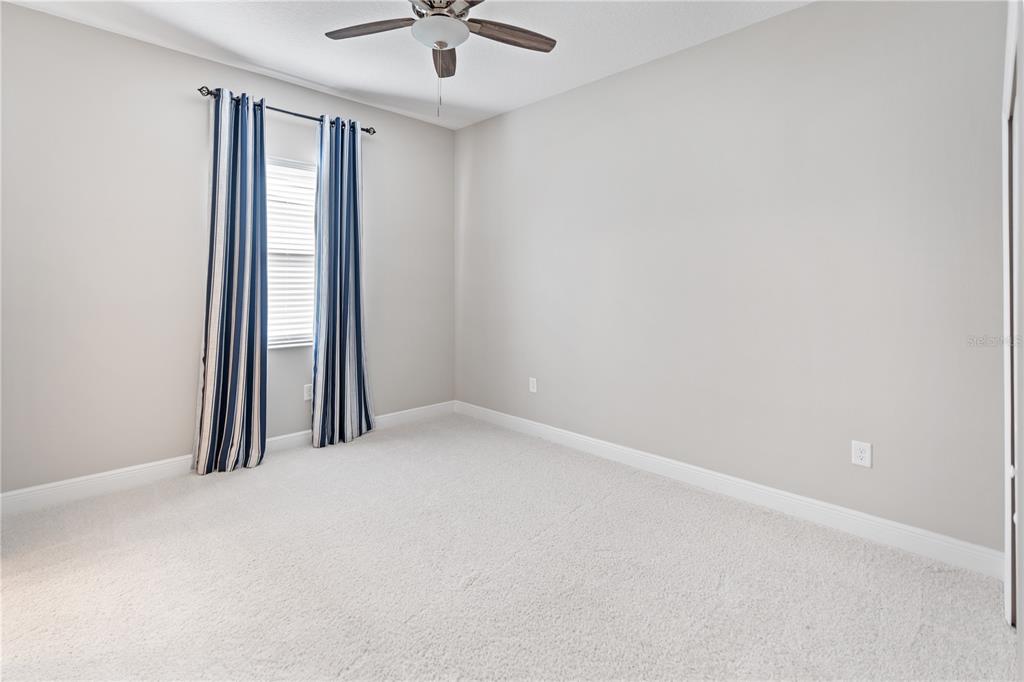 13017 Steinhatchee Loop Venice, FL 34293 - Photo 32 of 98 an empty room with a empty space and a ceiling fan