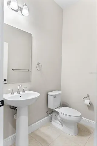a view of a tennis court with a table and chairs