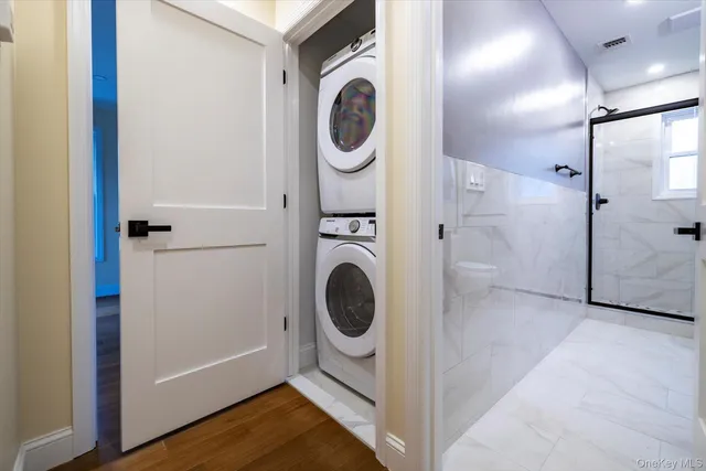 a view of a hallway with washer and dryer