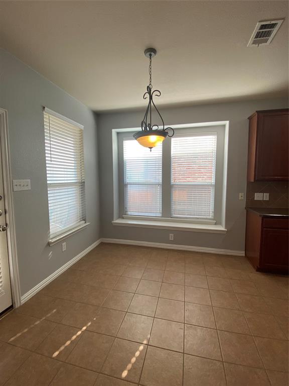 1708 Adams Place Prosper, TX 75078 - Photo 6 of 13 a view of an empty room with a window