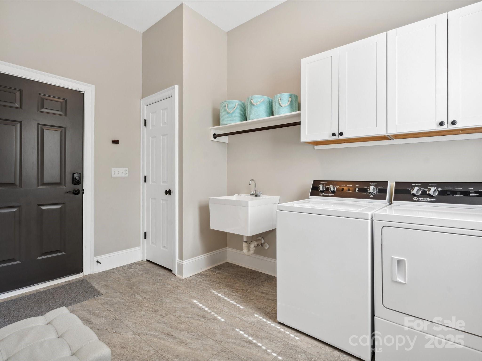 894 Stratford Run Drive Fort Mill, SC 29708 - Photo 20 of 45 a view of washer and dryer with bathroom in the background