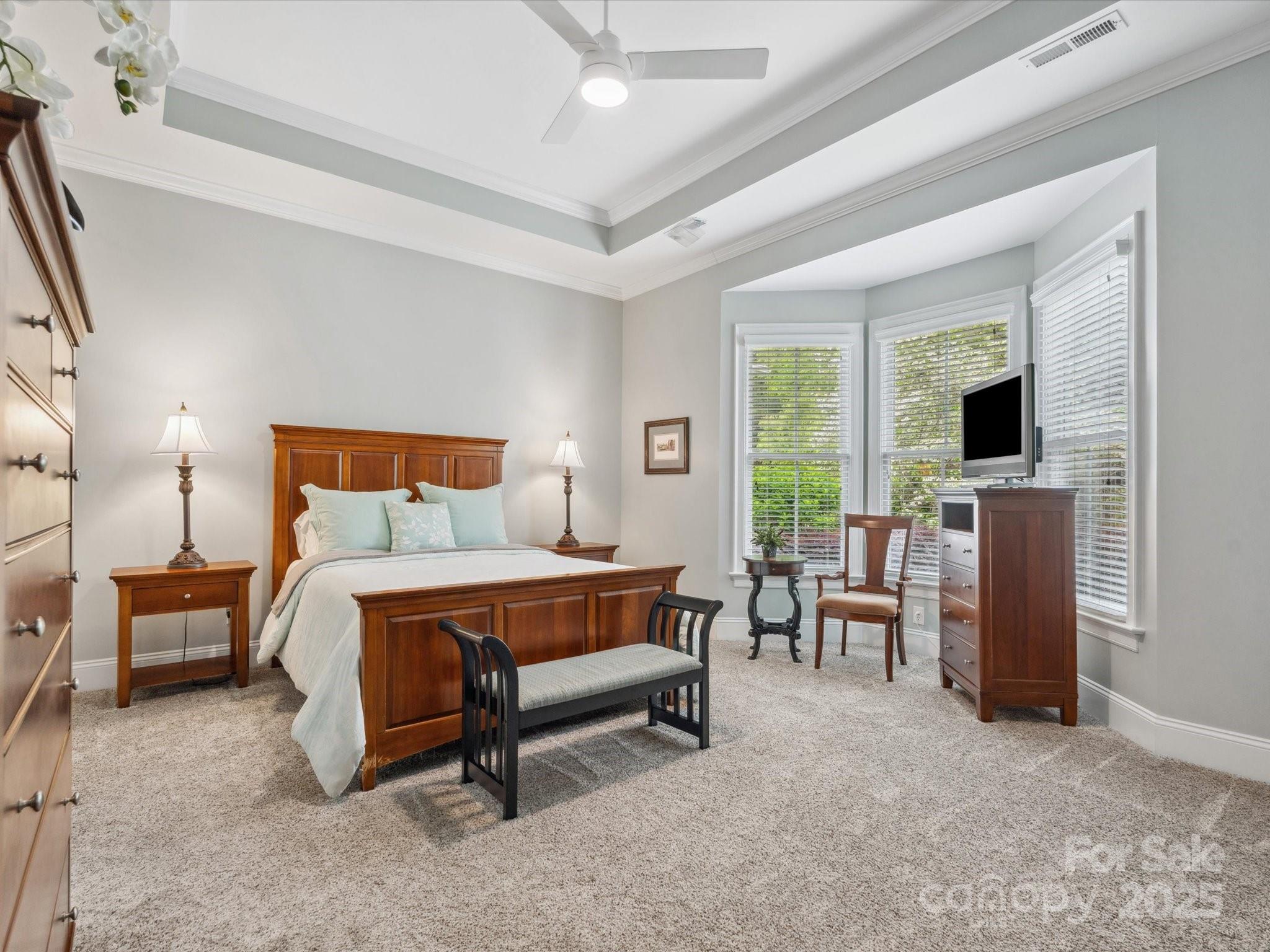 894 Stratford Run Drive Fort Mill, SC 29708 - Photo 23 of 45 a bedroom with furniture and a flat screen tv
