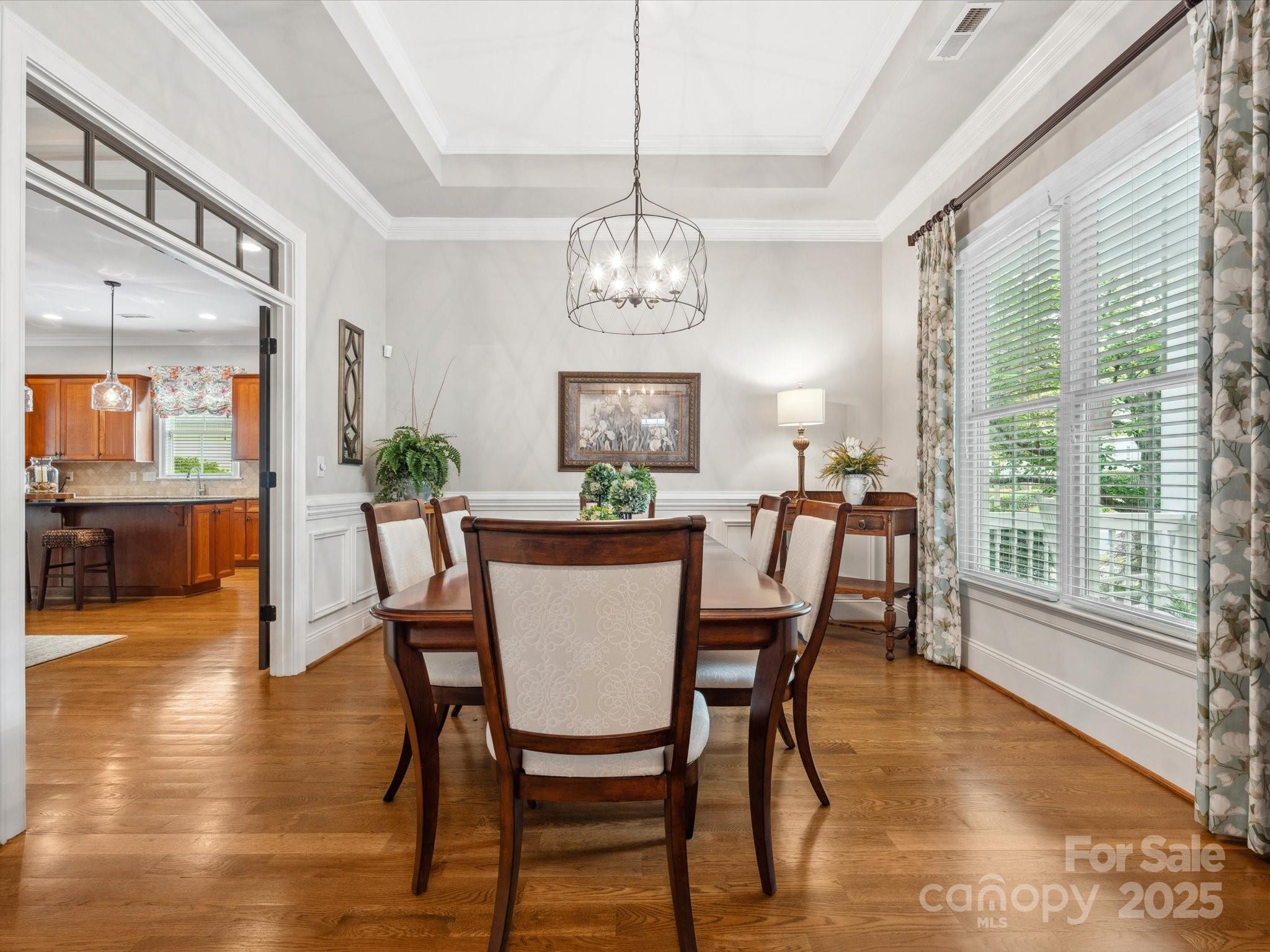 894 Stratford Run Drive Fort Mill, SC 29708 - Photo 4 of 45 a view of a dining room with furniture window and wooden floor