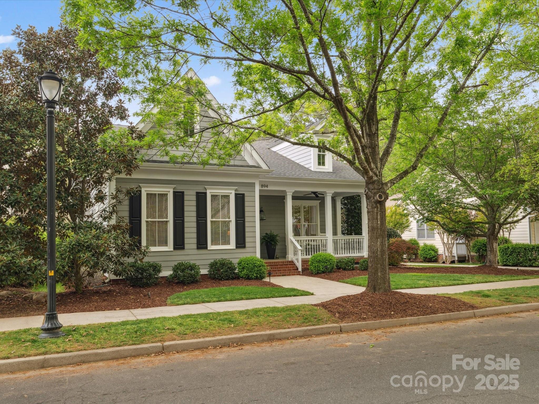 894 Stratford Run Drive Fort Mill, SC 29708 - Photo 42 of 45 a front view of a house with a garden