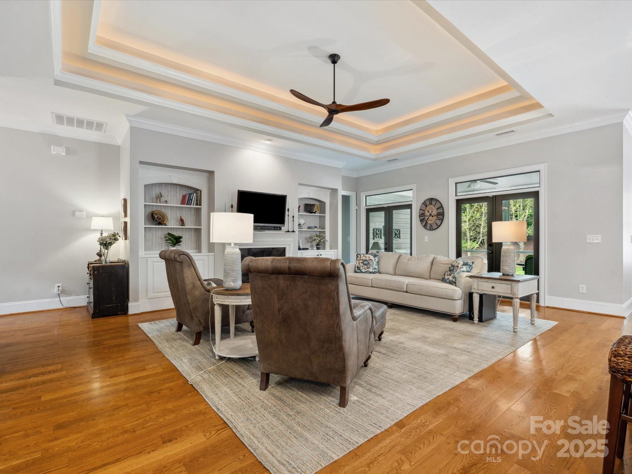 894 Stratford Run Drive Fort Mill, SC 29708 - Photo 10 of 45 a living room with furniture a fireplace and a flat screen tv