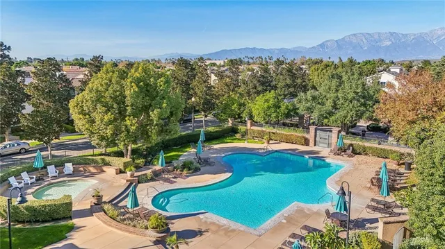 an aerial view of a house with swimming pool yard and outdoor seating