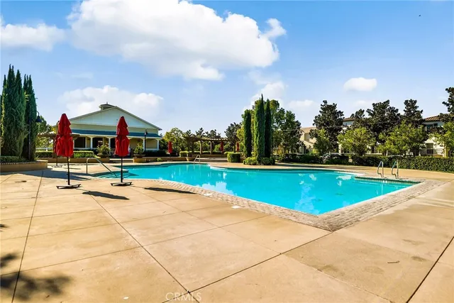 a view of swimming pool with lounge chair