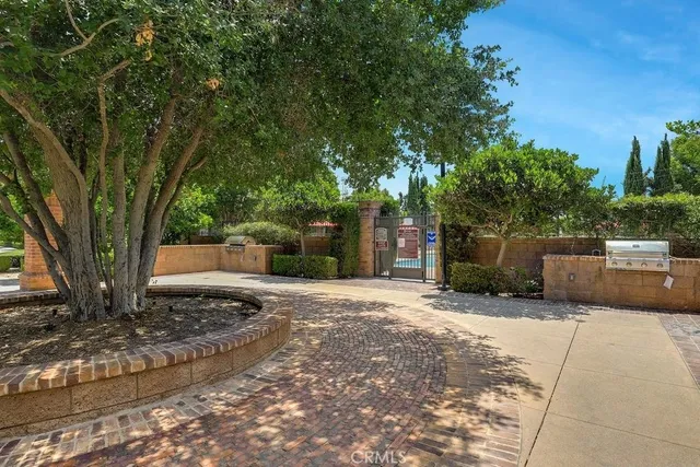 a view of a backyard with tree