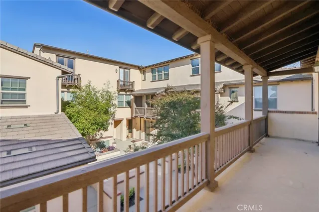 a view of a balcony with furniture