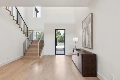 a view of a hallway with stairs