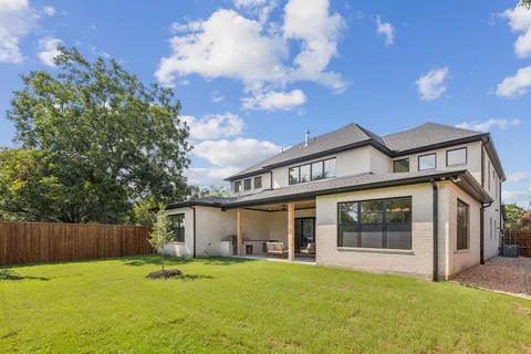 a view of a house with a yard and garage
