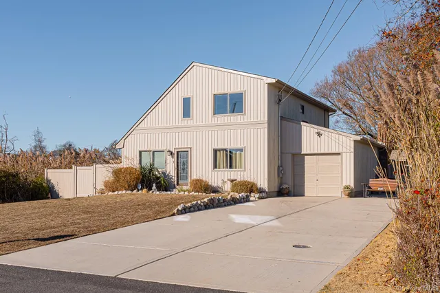 a view of a white house with a snow