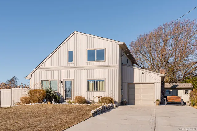 a view of a house with snow on the road