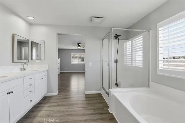 a bathroom with a sink a mirror and a bathtub