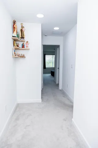 a view of a hallway with an empty room