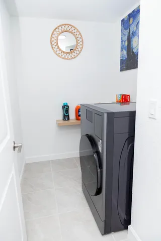 a utility room with a dryer and washer