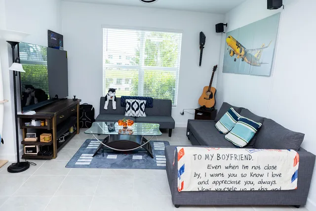 a living room with furniture and a flat screen tv