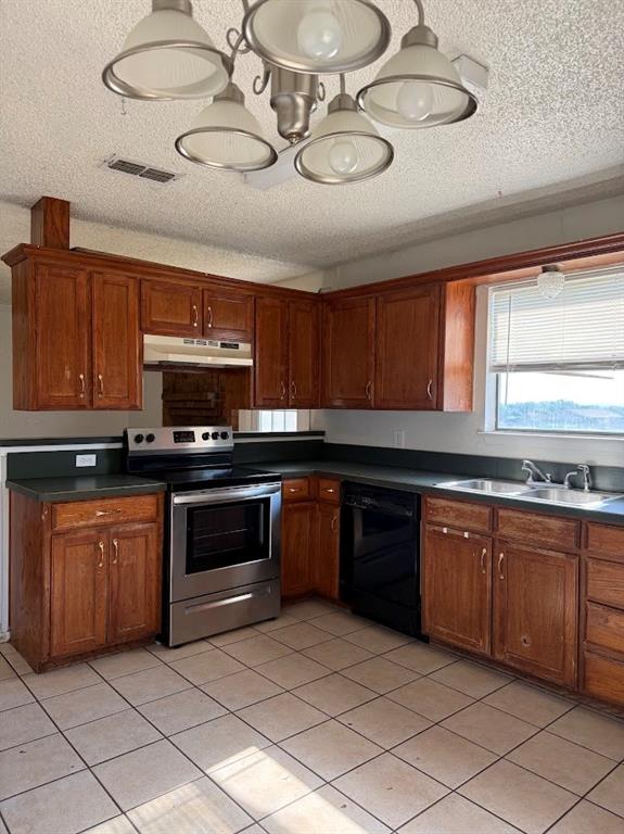 11204 Liberty School Road Pelican Bay, TX 76020 - Photo 7 of 23 a kitchen with stainless steel appliances granite countertop a sink and cabinets