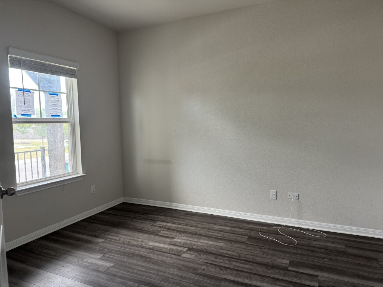 11509 Copperstone Avenue, Unit 92 Austin, TX 78748 - Photo 2 of 11 a view of an empty room with wooden floor and a window