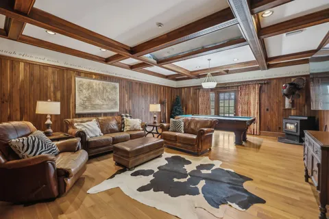 a bed room with a bed couch and a window