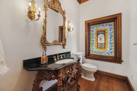 a kitchen with a sink a counter top space and stainless steel appliances