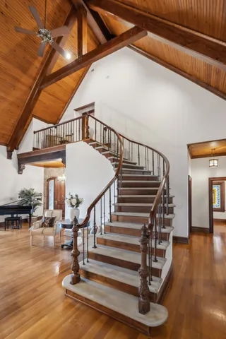 a bedroom with furniture and a chandelier
