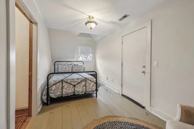 a view of a livingroom with furniture and a flat screen tv