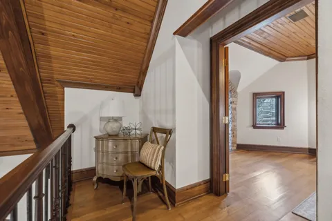 a spacious bathroom with a double vanity sink large mirror and a bathtub