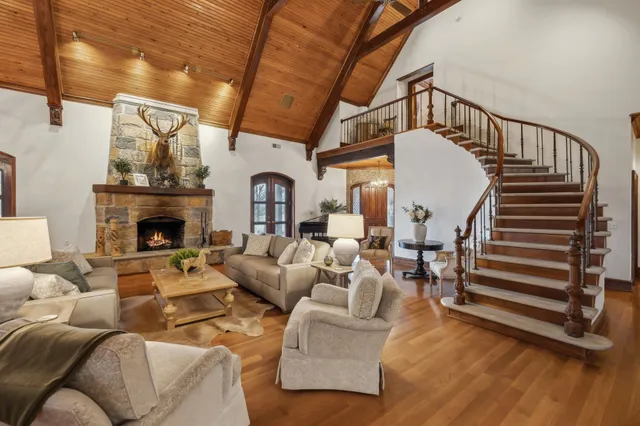 a view of a dining room with furniture wooden floor and a chandelier