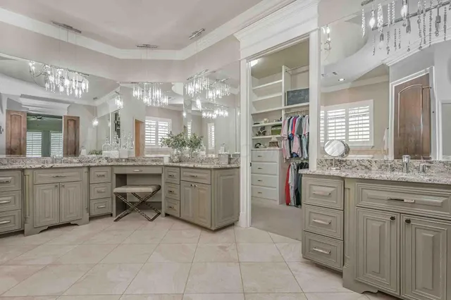 a kitchen with cabinets and window