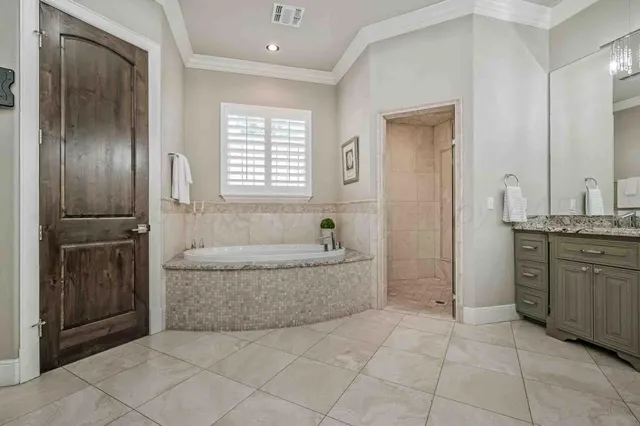 a spacious bathroom with a tub shower and sink