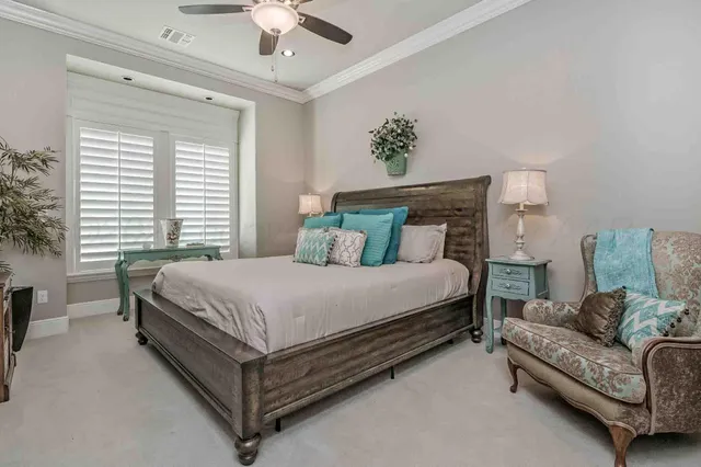 a bedroom with a bed couch and window