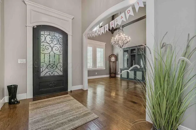 a view of an entryway with wooden floor