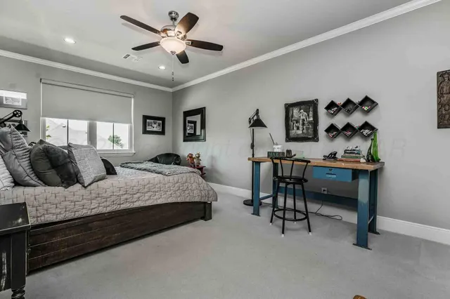 a bedroom with a bed and a table